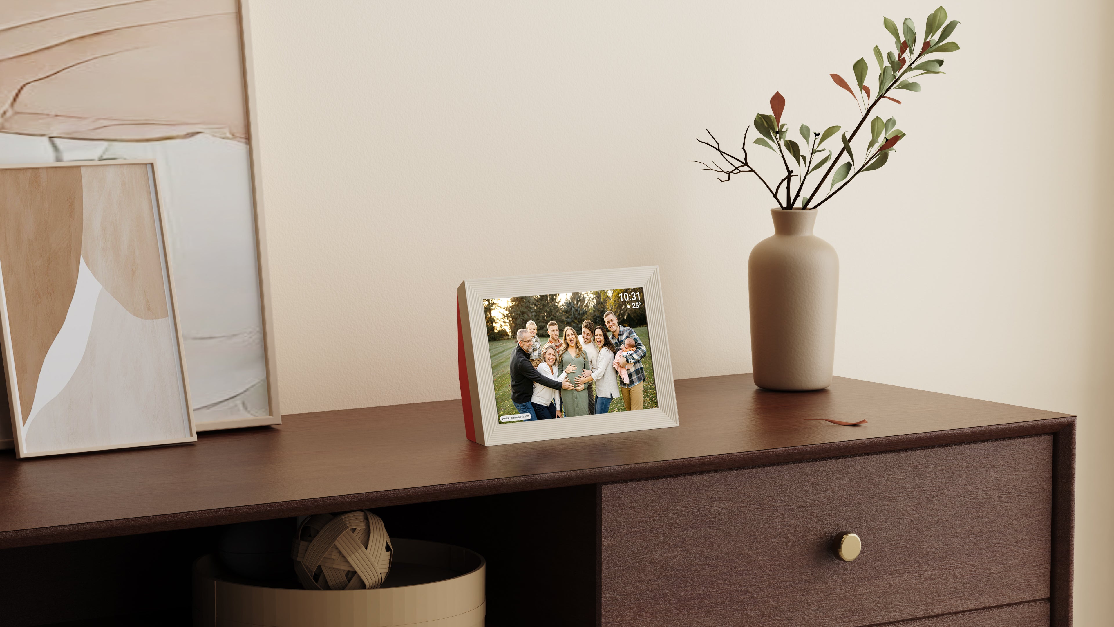 Framed photo of a family on a wooden shelf with a vase and decor items.